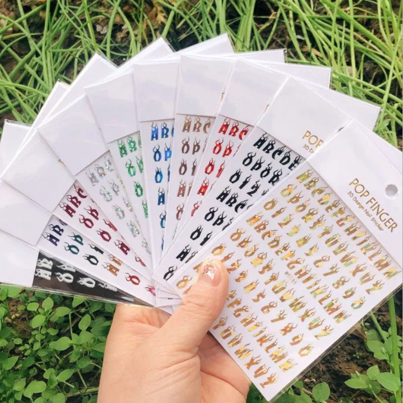 Color: WHITE - 1PCS New English Alphabet Nail Stickers Multi-Color Laser Reflective Nail Slider Art Cool Text Nail Kit