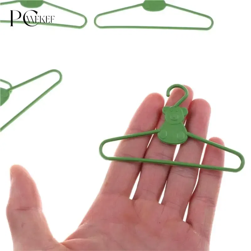 Color: plum - 10/20 PCS / Lot Lovely Green Hangers Mini Cute Wardrobe Dress Coat Clothes Plastic Accessories For Babi Doll Dollhouse Gift Toy
