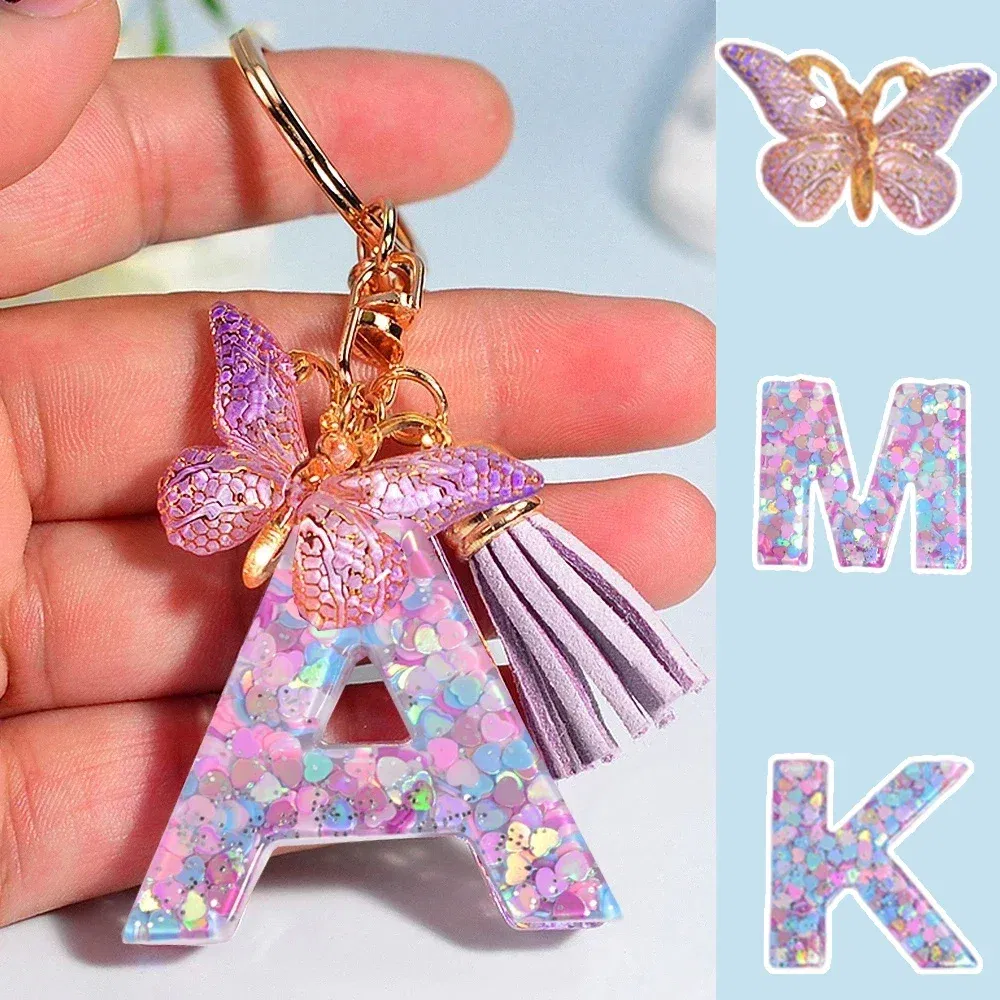 Color: Silver - Fashion Tassel Butterfly 26Letter Keychain Colorful Love Heart Filled Resin Alphabet Keyring Women Girls Car Bag Phone Pendant