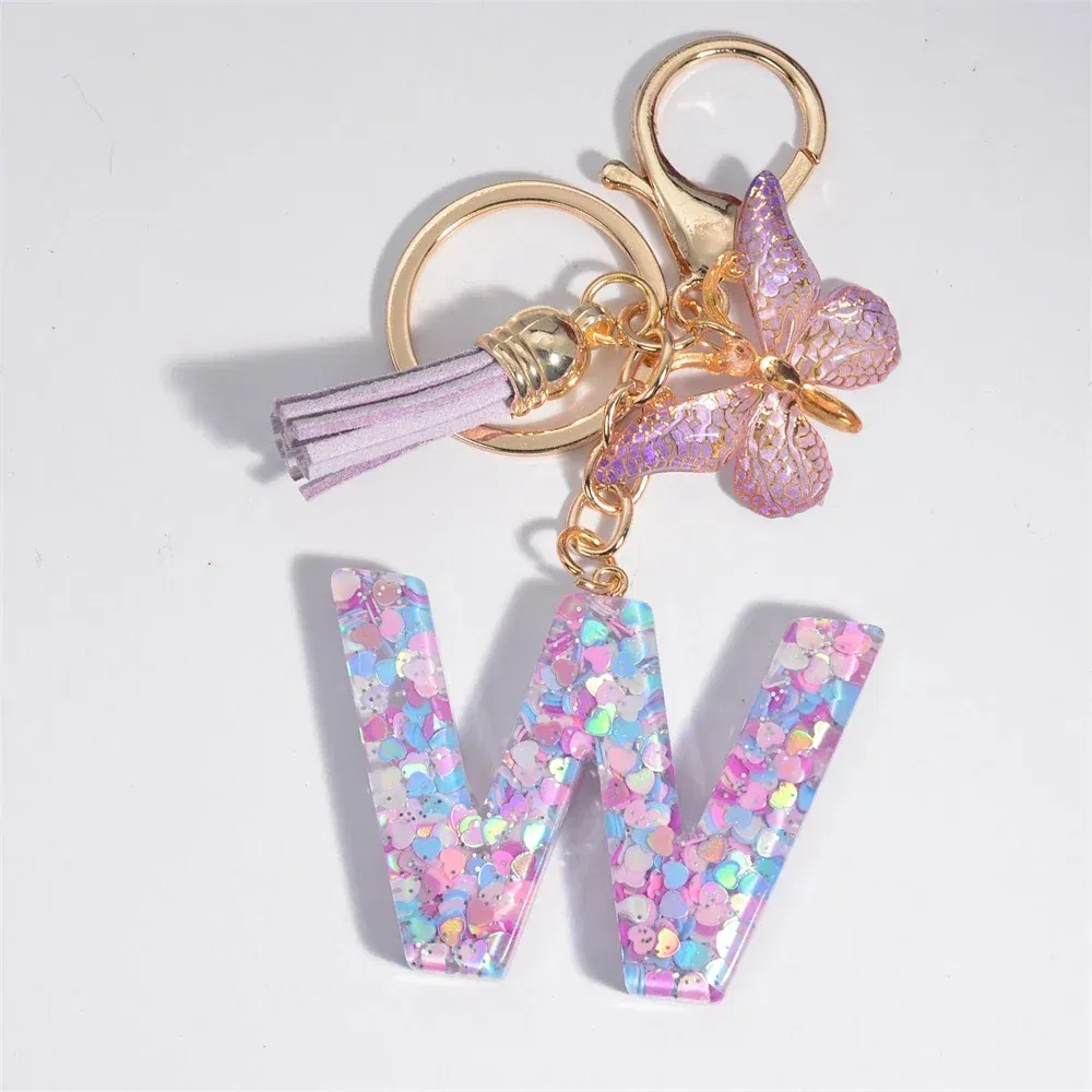 Color: Silver - Fashion Tassel Butterfly 26Letter Keychain Colorful Love Heart Filled Resin Alphabet Keyring Women Girls Car Bag Phone Pendant