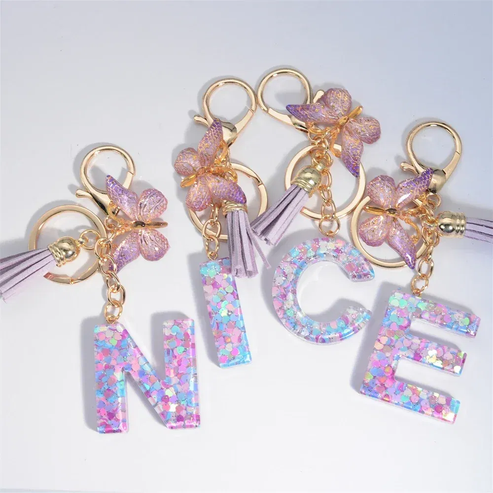 Color: Silver - Fashion Tassel Butterfly 26Letter Keychain Colorful Love Heart Filled Resin Alphabet Keyring Women Girls Car Bag Phone Pendant