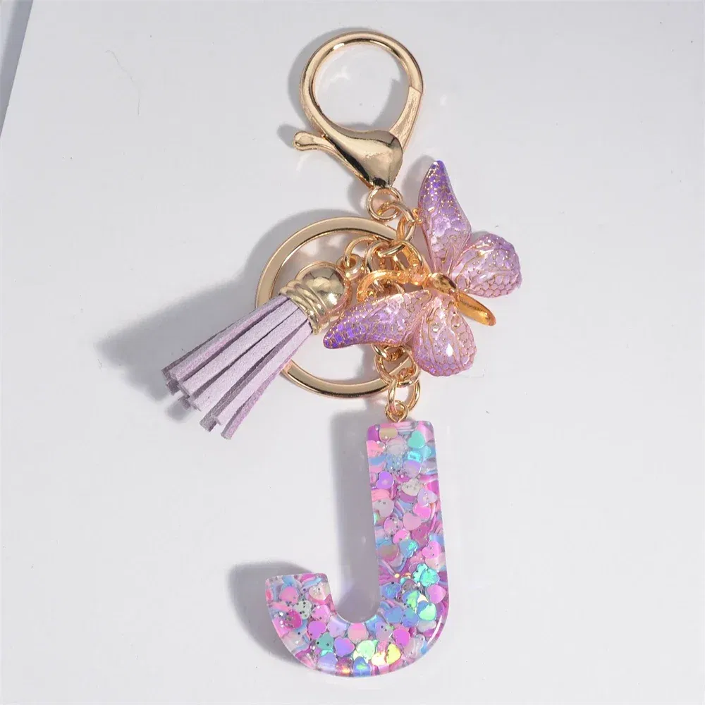 Color: Silver - Fashion Tassel Butterfly 26Letter Keychain Colorful Love Heart Filled Resin Alphabet Keyring Women Girls Car Bag Phone Pendant